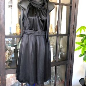 Beautiful black dress, side zip with neck-tie. Size 2, great condition.